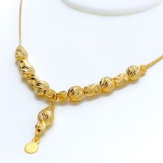 Weighing 10.2 grams, this 21k gold necklace showcases a decorative design with a radiant yellow gold finish, perfect for a dressy occasion. The 17-inch length provides a comfortable fit, while the 1.25-inch drop adds an elegant touch of sophistication. Secured with a lobster lock, this piece combines timeless beauty with intricate craftsmanship, making it an ideal accessory for special events or to elevate everyday style. PRODUCT DETAILS Gold Purity(karat): 21k Gold Weight(grams): 10.2 Item Fini Elegant Gold-plated Gold Necklace, 16 Inch Yellow Gold Plated Chain Necklace, Elegant Gold-tone Necklace With Gold Beads, Yellow Gold Plated Bridal Necklace, Elegant 22k Gold Plated Necklaces, Formal Gold Plated Drop Necklace, Formal Gold-plated Drop Necklace, Gold Necklaces With Elegant Pendant Design, Elegant Yellow Gold Chain Necklace With Gold Beads