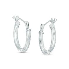 Details set these hoops apart from others. Fashioned in 14K white gold, each 13.0mm hoop earring boasts intricate diamond-cut detailing and a bright buffed finish. A great look any time, these hoops secure with hinged backs. Classic Diamond Cut Hoop Earrings For Everyday, White Gold Hoop Earrings With Lever Back, White Gold Hoop Earrings With Lever Back Ear Wires, Oval Sterling Silver Hoop Earrings With Diamond Cut, Oval Diamond Cut Sterling Silver Hoop Earrings, Small Hoop Earrings In White Gold, Sterling Silver Huggie Earrings With Lever Back For Anniversary, Small Silver Hoop Earrings With Diamond Cut, Small Hoop Diamond Cut Earrings