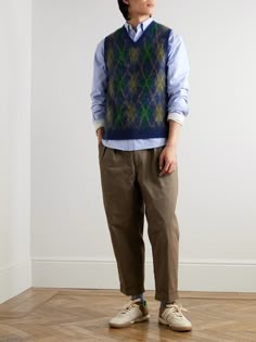 The appreciation of style that withstands the test of time is key to BEAMS PLUS' collections. Pattnerned in blurred Argyle, this vest has been jacquard-knitted in Japan with wool and mohair threads, then brushed to enhance the soft handle. Layer yours over a slim rollneck or collared shirt.