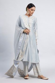 Teal blue kurta with princess-cut, placement floral motif parsi gara embroidery and pearl lace border. Comes with dogri salwar and silk organza dupatta.
Component: 3
Embroidered
Neckline: Band Collar
Sleeve Length: Three Quarter
Fabric: Kurta: Chanderi Silk; Salwar: Bamber Satin; Dupatta: Silk Organza
Color: Blue
Princess-cut
Concealed placket
A-line silhouette - Aza Fashions Pearl Lace Border, Parsi Gara Embroidery, Gara Embroidery, Salwar Pants, Blue Kurta, Pearl Lace, Pearl And Lace, Fancy Dress Design, Indian Suits