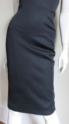 For Sale on 1stDibs - A fabulous black silk jersey strapless dress from Gianni Versace Couture. It is fitted with flattering seaming and the center back has functional on the Modern Black Pencil Skirt For Evening, Sleek Fitted Evening Pencil Skirt, Modern Fitted Skirt For Evening, Classic Fitted Evening Skirt, Luxury Fitted Skirt For Gala, Luxury Fitted Evening Skirt, Elegant Fitted Pencil Skirt For Evening, Modern Fitted Pencil Skirt For Formal Occasions, Luxury Black Skirt For Cocktail Events