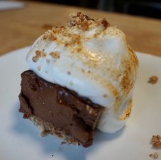 a piece of chocolate pie with whipped cream on top