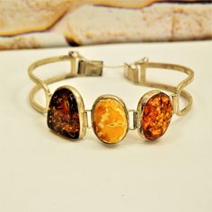 MULTI AMBER BRACELET, Sterling Silver Hinged Bracelet, Gift for Her by ANTIQUE4YOU Three amber bracelet, Multi color amber, Amber silver jewelry, Estate amber jewelry, Butterscotch amber, Cognac amber, Honey amber, Gift for Mother, Gift for wife. STAMPED 925 STERLING SILVER. 3 DIFFERENT COLOR AMBER STONES. ESTATE AMBER JEWELRY. 7.5"  GREAT GIFT FOR HER. *BEFORE PLACING ORDER, PLEASE, MAKE SURE YOUR ADDRESS IS CORRECT IF YOU PLACED ORDER WITH UNVERIFIED ADDRESS OR HAD MISTAKE IN IT AND IF PACKAGE Amber Bracelet, Hinged Bracelet, Amber Stone, Gift For Mother, Bracelet Sterling Silver, Amber Jewelry, Gift For Wife, Cute Earrings, Bracelet Gift