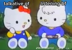 two hello kitty dolls sitting next to each other in front of a tree and grass area