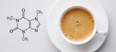 a cup of coffee sitting on top of a white saucer next to a chemical model