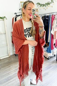 Looking for a stylish and fun way to stay warm this winter? This cute and cozy wrap is perfect for chilly days and nights, and can be dressed up or down to suit any occasion! #lovemyleto 100% Acrylic Imported One Size Cozy Cotton Cardigan, Bohemian Knit Cardigan For Fall, Bohemian Winter Cardigan, Trendy Winter Festival Outerwear, Knit Fringe Outerwear For Fall, Knit Outerwear With Fringe For Fall, One Size Fringe Cardigan For Fall, Long Fall Outerwear With Tassels, Oversized Bohemian Cotton Outerwear