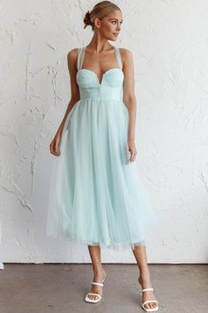 Mint midi dress Lined Boning in bodice Tulle mesh skirt Lace-up back Zipper in back You'll feel like a princess in our Surreal midi dress. Perfect for a wedding or special occasion where you need to look like literal royalty. We are obsessed with its floaty tulle skirt and stunning, lace-up back. Team it with diamante heels and a clutch for a look that'll have Prince Charming lost for words. MODEL INFO Model is wearing size XS Height: 5'8" Bust: 32" Waist: 25" Hips: 35" SIZE INFO Flat garment me Midi Dress Tulle, Fancy Formal Dresses, Mint Midi Dress, Turquoise Midi Dress, Lost For Words, Tulle Midi Dress, Selfie Leslie, Yellow Bridesmaids, Red Bridesmaids