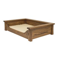 a dog bed made out of wood with a mattress on the bottom and bottom side