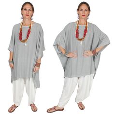 Austria Moroccan Cotton Poncho Tunic Top • Bust - Hips 94" • Sleeve width 22"• Length 30"-33" Our best-selling generously designed over-size tunic top. Everyone, love the Mirage Poncho that is so flattering to all figures. Because hand-woven Moroccan Cotton sousdie is like jersey knit (remember those fabulous 1940's dresses?) it drapes like a dream. So wear it loose like the model or belted for a more ethnic look. Soft, luxurious and a goodly weight- that's why we call it the Cashmere of cotton! Casual Flowy Tunic For Loungewear, Flowy Casual Tunic For Loungewear, Oversized Tunic Top For Vacation, Loose Fit Beach Tunic Top, Summer Tunic With Batwing Sleeve And Relaxed Fit, Bohemian Oversized Tunic Tops, Oversized Bohemian Tunic Tops, Casual Batwing Sleeve Tunic For Vacation, Bohemian Loungewear Tops With Batwing Sleeves