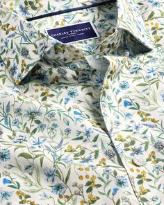 100% cotton, Available in classic and slim fit, Made with Liberty fabric, made in Italy, Exclusively designed for CT, Semi-spread collar, Rounded button cuff with one button, Classic and slim fit: back pleats, Machine washable - Made with Liberty Fabric Semi-Cutaway Collar Floral Print Shirt - Multi | Men's Charles Tyrwhitt Made With Liberty Fabric Semi-Cutaway Collar Floral Print Casual Shirt Size Large Cotton Fitted Cotton Dress Shirt With Casual Collar, Fitted Spring Dress Shirt With Button Closure, Fitted Spring Dress Shirt, Classic Fitted Collared Tops, Classic Fitted Dress Shirt, Spring Dress Shirt With Spread Collar, Classic Collared Tops With Floral Print, Classic Collared Top With Floral Print, Classic Fitted Shirt With Casual Collar