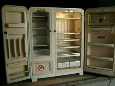 three open refrigerators sitting side by side