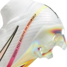 the nike merance soccer shoe has been painted white with pink and yellow accents