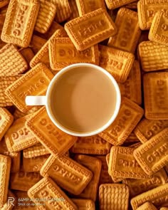 a cup of coffee surrounded by waffles