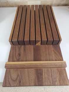 two wooden benches sitting on top of each other