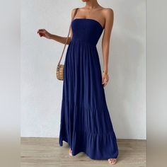 Chic Smocked Tube Top Tiered Maxi Dress * Strapless * Sleeveless * Smocked Stretch Tube Top * Unlined * Stretch High Waist * Tiered Ruffle Long Skirt * Flowy A Line *Approximate Unstretched Measurements* Xs (2) * Bust 29"(Up To 34") *Waist 25"(Up To 26") * Hip 43" *Length 49/55" Small (4) * Bust 30"(Up To 35.25") *Waist 26"(Up To 27.5") * Hip 45" *Length 50/56" Medium (6) * Bust 28"(Up To 37") *Waist 28"(Up To 29") * Hip 46.5 * Length 50/57.5" Large (8/10) * Bust 34"(Up To 39.5") *Waist 34"(Up T Casual Strapless Maxi Dress With Smocked Back, Chic Strapless Smocked Dress For The Beach, Strapless Smocked Bodice Sundress For Beach, Strapless Sundress With Smocked Bodice For Beach, Casual Bandeau Dress With Ruched Detail, Casual Ruched Bandeau Dress, Bandeau Smocked Dress For Beach, Strapless Smocked Dress For Vacation, Summer Strapless Smocked Dress With Ruched Detail