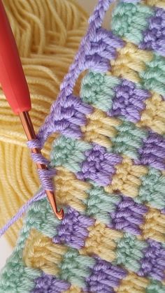 the crochet is being worked on with a needle