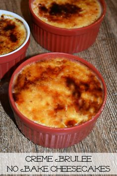 three red dishes filled with cheesecakes on top of a wooden table