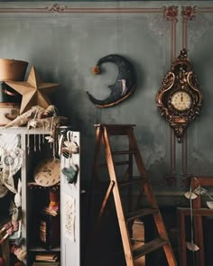 a room filled with lots of different types of furniture and decor on display in front of a clock