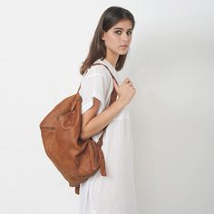 Brown Leather Backpack by CyanByMiriWeiss Softback Soft Leather Backpack For Daily Use, Everyday Shoulder Bag Backpack With Leather Lining, Everyday Shoulder Bag With Leather Lining Backpack Style, Everyday Shoulder Bag With Leather Lining And Backpack Shape, Softback Soft Leather Backpack For Everyday Use, Everyday Softback Backpack In Soft Leather, Versatile Everyday Backpack With Leather Lining, Everyday Softback Soft Leather Backpack, Brown Satchel Backpack For Everyday Use