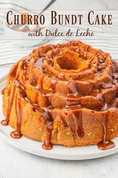 a bundt cake covered in caramel drizzle on a white plate