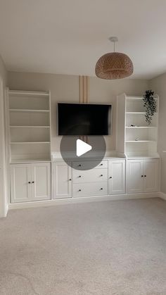 a living room with built in bookshelves and a flat screen tv