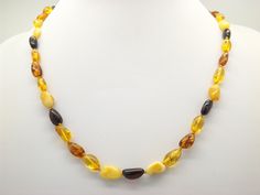 Hello and welcome to my shop. I am are offering to you this lovelt studio handmade abstract design early period bead necklace. As you will see in the pictures it is handmade with shiny mixed shape and coloured / shade natural yellow to brown beads hand knotted inbetween. The necklace clasp is a hand made screw type in good working order. The handmade mixed yellow to brown bead necklace is in an excellent used vintage condition with no or only very slight age related surface wear as shown. So please see my five pictures as they are part of my description of the  details of the colours, design and general condition of this fine piece of vintage jewelry. Thanks.  The piece is unmarked. The length of the necklace is:-  57 cms  22 1/4 inches approx. Please see picture five for more details. I a Handmade Yellow Baltic Amber Necklaces, Handmade Yellow Baltic Amber Necklace, Handmade Baltic Amber Necklace In Yellow, Brown Beaded Necklace, Necklace Clasps, Abstract Design, Shades, Vintage Jewelry, Beaded Jewelry