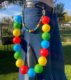 A Kandi belt chain made with pony beads, specialty beads, charms, and ball pit balls. Perfect for raves or any occasion to feature a stand out accessory! Kandi Belt, Ball Pit Balls, Belt Chain, Ball Pit, Beads Charms, Pony Beads, A Stand, Chains Necklace, Valentine Gifts