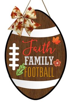 a wooden sign that says faith, family and football with leaves on the bottom of it