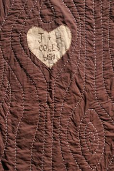 a quilt with a heart on it