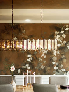 a dining room table with chairs and chandelier