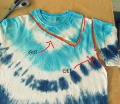 a tie - dyed shirt is cut and sewn with scissors