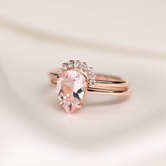 an engagement ring with a pink morganite and diamonds