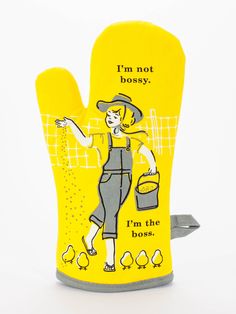 a yellow oven mitt with an image of a woman holding a bucket and chickens