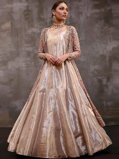 <p><strong>Over-Top:<br /></strong>Color: Vivid Tangerine<br />Fabric: Organza<br />Long shirt adorned beautifully with floral embellishments accent the neckline, all over front, sleeves, front borders and hemline<br />Light embellishments on back<br />Full sleeves<br />Split front<br />Fully lined<br />Edges finished<br /><br /><strong>Under-gown:<br /></strong>Color: Vivid Tangerine<br />Fabric: Tissue Organza<br />Comes with plain floor length gown<br />Rounded neckline<br />Sleeveless<br />H Floor-length Ball Gown With Intricate Embroidery For Wedding, Floor-length Wedding Dress For Eid Reception, Embellished Gown For Wedding Eid Festival, Embellished Gown For Wedding And Eid, Gold Wedding Dress For Eid Reception, Elegant Floor-length Wedding Dress For Eid, Floor-length Wedding Dress For Eid, Elegant Festive Ball Gown For Reception, Elegant Floor-length Wedding Dress With Zari Work