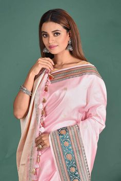 Go for demure elegance at parties and festive occasions in this light pink Banarasi Katan silk saree. The saree has a green zari border. It comes with a matching blouse piece. Disclaimer: The shown stitched blouse on the model is for display purpose only. The saree comes with a matching blouse piece and finished with fall and piko. Fashion Journals, Silk Sarees Online, Traditional Fabric, Georgette Sarees, Banarasi Sarees, Indian Sarees, Sarees Online, Blouse Piece, Blouse Dress