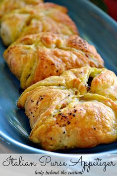 several croissants are on a blue plate