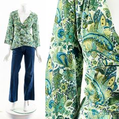 "y2k emerald green paisley boho blouse plunging neckline 3/4 length bell sleeves faux wrap front gathering along shoulder yoke Fits like: small-medium Material: Polyester Spandex Condition: Great Clipped on Mannequin: No ✂ SIZE + FIT ✂ Length: 24\" / 61 cm Shoulders, seam to seam: 17\" / 86 cm Sleeve Length: 19\" / 97 cm Bust: 40\" / 51 cm Waist: 35\" / 44 cm All measurements are taken with garment lying flat. ALWAYS refer to measurements as vintage sizes run can vary greatly from today's modern Vintage Stretch V-neck Top, Vintage Printed V-neck Top, Vintage V-neck Top With Boho Print, Spring V-neck Paisley Print Tops, Green V-neck Hippie Top, Vintage Printed V-neck Blouse, Non-stretch Long Sleeve Bohemian Top, Non-stretch Bohemian Long Sleeve Top, Bohemian Non-stretch Long Sleeve Tops