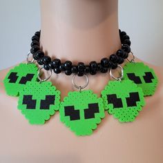 These kandi necklaces are made with pony beads and alien charms. One size fits all. This Item adjust up to 17 Inches.  This Item is made to order. Perfect for any event! You will get lots of compliments in this unique wearable art! Stand out at your next event! Edm festival  Raves Party  Rave outfit  Festival outfit Pride Handmade Adjustable Choker For Cosplay, Emo Halloween Festival Necklace, Adjustable Black Rave Style Choker, Adjustable Black Rave Choker, Adjustable Rave Style Choker, Adjustable Rave Choker For Festival, Rave Jewelry For Halloween Party, Handmade Emo Jewelry For Festivals, Black Rave Style Choker Jewelry