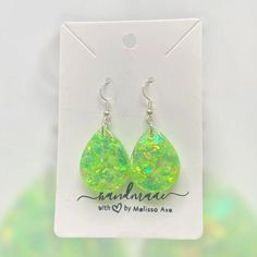 Each earring is handcrafted with care.  * Handcrafted with high-quality resin for durability and beauty. * Lightweight design for comfortable all-day wear. * Hypoallergenic for sensitive ears. * Each earring is unique and may be slightly different from what is pictured. No two earrings are completely alike. Material: * UV resin * Glitter * Hypoallergenic and nickel free Stainless Steel hardware Care: *To clean your earrings, use a damp cloth and wipe gently. *Remove the earrings before showering or swimming. *Avoid using chemicals, perfume, jewelry cleaners, or any aerosol products. Do not hesitate to send me a message if you have any questions. Please check my other listings at https://designsbymelissaa.etsy.com. Trendy Hypoallergenic Teardrop Earrings For Gift, Trendy Teardrop Earrings As A Gift, Handmade Green Teardrop Earrings, Trendy Hypoallergenic Dangle Teardrop Earrings, Trendy Hypoallergenic Teardrop Drop Earrings, Trendy Nickel-free Teardrop Earrings, Hypoallergenic Pear-shaped Teardrop Earrings As A Gift, Hypoallergenic Teardrop Drop Earrings As Gift, Hypoallergenic Teardrop Drop Earrings For Gift