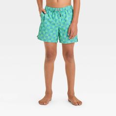 These Checkered Swim Shorts from art class™ bring on-trend flair to your kid's summer wardrobe. Made from 100% recycled polyester twill fabric with built-in boxers for comfortable wear in and out of water, these mid-rise swim shorts feature a UPF 50+ rated material helps protect them from the sun's rays. An adjustable waistband with a front drawstring offers a secure fit, while two side pockets come in handy for stashing small essentials. Featuring a checkered print with each square in ombre hue Casual Summer Swim Trunks For Playwear, Spring Playful Swim Trunks For Playwear, Playful Swim Trunks For Spring Playwear, Casual Swim Trunks For Summer Playwear, Spring Swim Trunks With Elastic Waistband For Playwear, Casual Spring Swim Trunks For Playwear, Trendy School Shorts For Summer, Trendy Summer Shorts For School, Playful Swim Trunks With Elastic Waistband For Spring