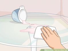 a person using a hand dryer to clean a table with pink liquid on it