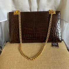 This Argentine-Made Genuine Alligator Purse Has Immaculate Gold Trim That Starts With The Chain Shoulder Strap And Continues With The Findings Where The Strap Connects. These Rectangles Make The Purse! It Is Undamaged And In Excellent Vintage Condition. The Bag Has Three Compartments, Including One Snap Closure. It Is The Top Of The Vintage Line In Every Possible Way. Alligator Purse, Trim Color, Gold Trim, Alligator, The Chain, Snap Closure, The Vintage, Shoulder Bags, The Bag