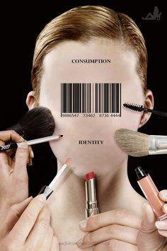 a man is holding makeup brushes in front of his face and the barcode behind him