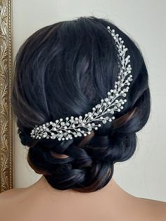 a woman wearing a bridal hair piece