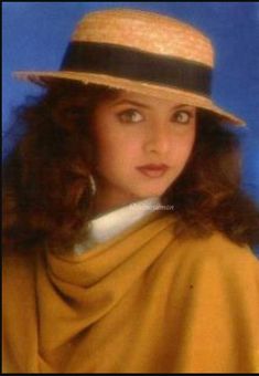 a woman wearing a brown hat and scarf