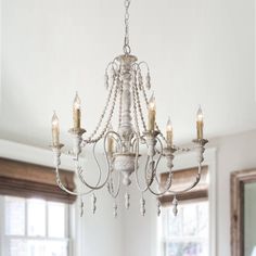 Lend striking visual appeal to your dining room or foyer with this chandelier. A durable wood frame ensures lasting quality, six lights surround the frame to emit glistening light throughout your space. Parrot Uncle 6-Light Distressed White French Country/Cottage WoodChandelier | BB8817-6110V French Country Chandelier Dining Room Lowe's, What Color Chandelier With White Farm Table, Farmhouse Chandelier Bedroom French Country, French Country Chandelier Overstock, French Country Chandelier The Home Depot, Farmhouse Cottage Chandelier, Homedepot Farmhouse Chandelier, French Country Kitchens Ceiling Lights, French Country Chandelier With Crystals