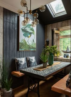 a dining room with a table and some plants