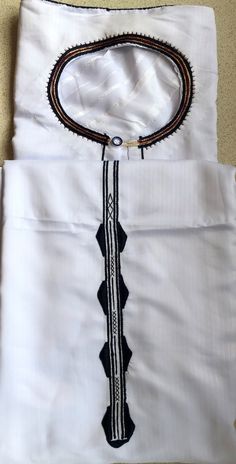 The Ugandan traditional original Kanzu -Carefully made with silken - cotton material  -to suit traditional/formal ocassion. Size for young age from 18 - 30 years Classic Fitted Cotton Kurta, White Cotton Traditional Wear With Embroidered Border, Cotton Traditional Wear With Embroidered Border For Ceremonies, Cotton Dabka Sets For Traditional Ceremonies, Elegant White Kurta With Traditional Patterns, Ceremonial Fitted Cotton Sets, White Cotton Traditional Formal Wear, Elegant Cotton Ceremonial Sets, Formal White Cotton Traditional Wear