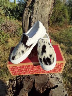 Women's 8.0, men's 6.5, white slip-on Vans.  I customized this pair with gorgeous black and white hair-on hide.  Very silky.  Stitched with black heavy duty thread, all done by hand.  Please ask any questions you may have about these shoes or a custom request.  Thanks for looking! Western Vans, Western Wedding Shoes, Customized Vans, White Slip On Vans, Vans Womens, Expensive Watches, Vans Slip On, White Slip, Western Wedding