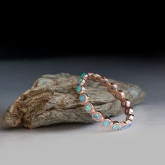 Red Gold ring - Opal gemstone ring - Blue stone ring Halo Round Band Jewelry Gift, Bohemian Jewelry With Bezel Setting For Gift, Bohemian Jewelry With Bezel Setting As Gift, Halo Eternity Band As A Gift, Opal Jewelry With Stone Setting As Gift, Bohemian Rose Gold Round Jewelry, Unique Jewelry With Halo Detail, Gemstone Eternity Band As Gift, Unique Turquoise Moonstone Ring